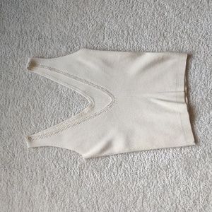 Cute lightweight cropped V-neck and back with opalescent beaded accents.